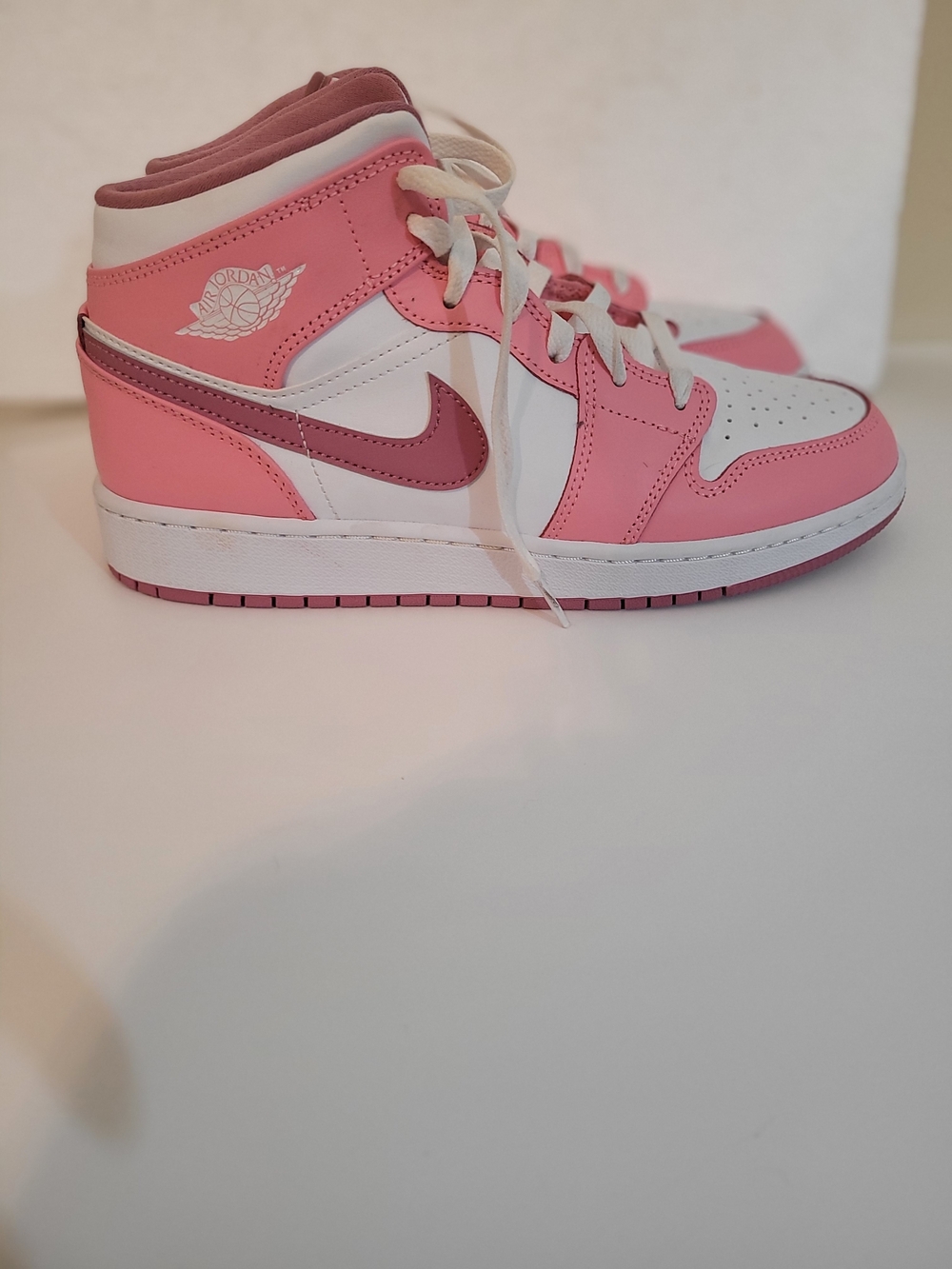 Jordan Pink and White High-Top Sneaker with Berry Swoosh